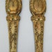 a pair of french ormolu furniture embellishments - (garniture)