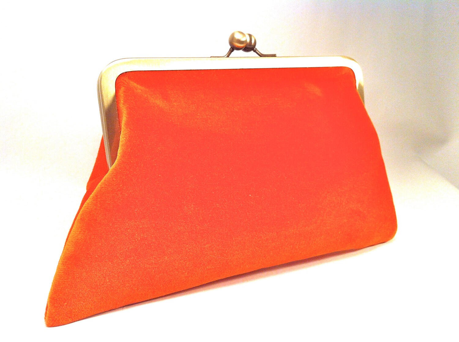 orange designer clutch