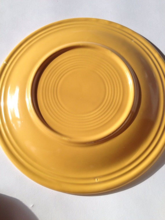 Original unmarked fiestaware dinner plate in yellow