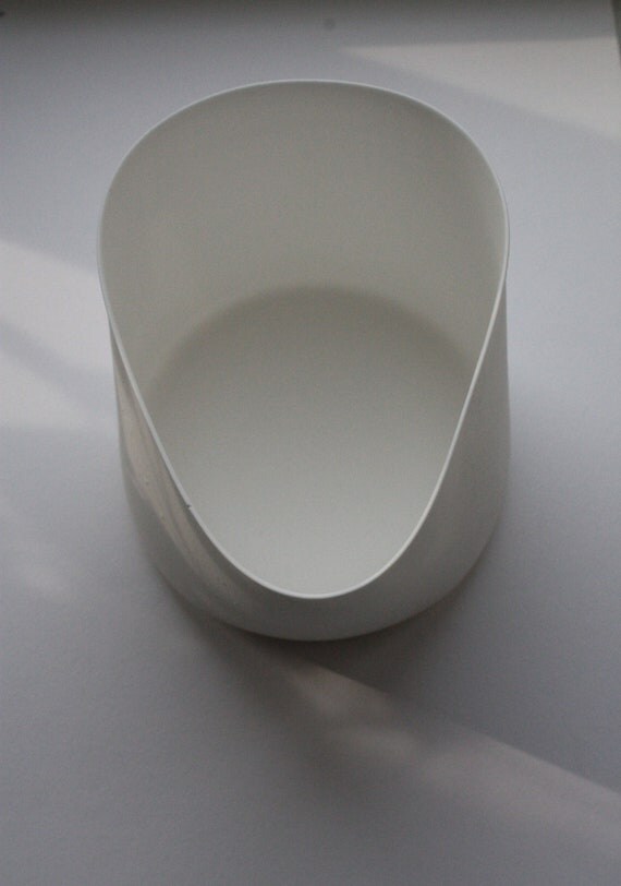 White vase with an unusual design from fine bone by madebymanos