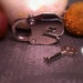 Small polished nickel padlock