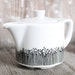 Handpainted tea pot "somewhat angular"