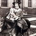 vintage photo Girl on Donkey Holds Doll RPPC