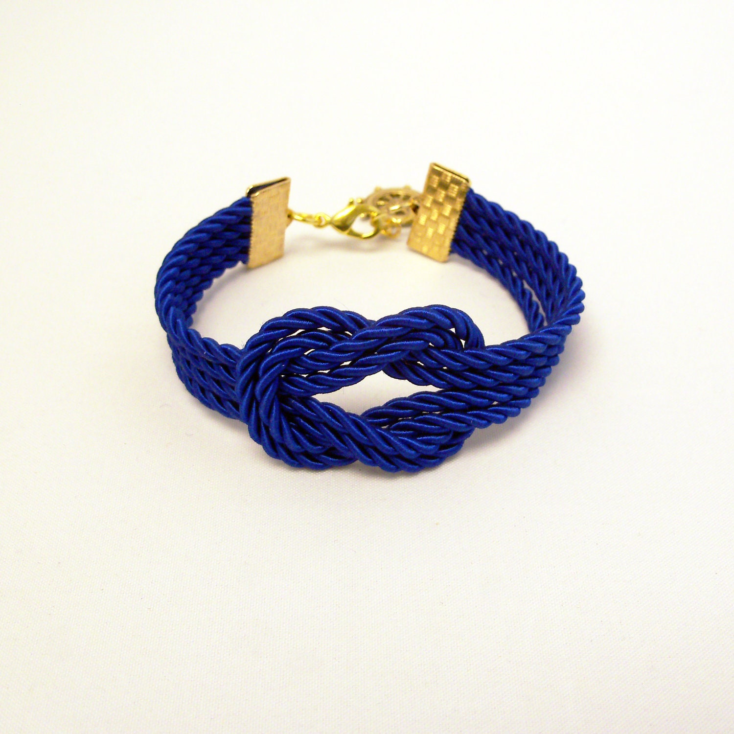 Royal blue forever knot nautical rope bracelet with gold ship