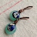 Harbinger Collection Lampwork discs with Blue and White Floral tin caps