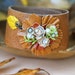 Autumn Bouquet. vintage assemblage ,brown leather, floral cuff. tiedupmemories