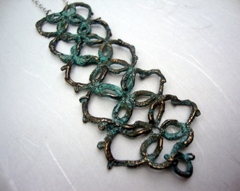 Long"collar" Lace necklace cast in bronze with blue patina