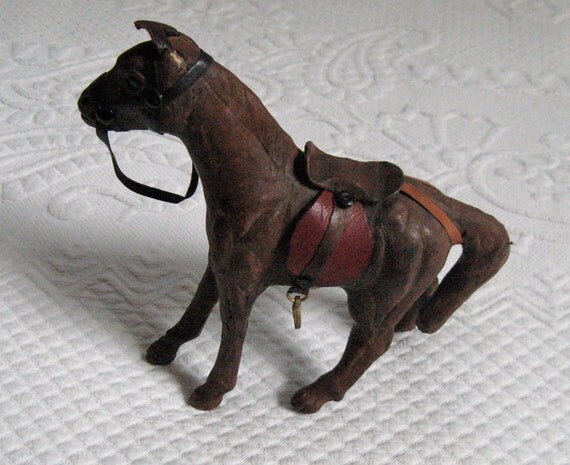 antique leather horse figurine