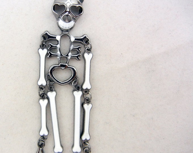 Long Hematite-tone Skeleton Pendant White Epoxy
