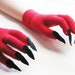red gloves with claws