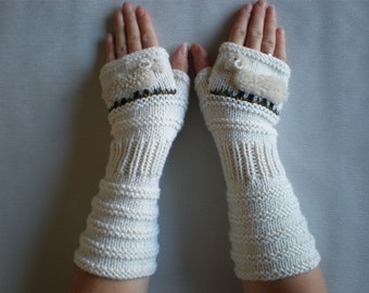 Hand-knitted white wrist warmers with hand needlecrafted sheep