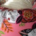 the JOSIE Small Donut Dog Bed- Alexander Henry Jardin de los Muertos Pink