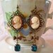 Traditional Vintage Cameo Earrings with Antiqued Brass Filigree Bows and Emerald Green Vintage Swarovski Foil Backed Faceted Cushion Gems