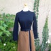 A vintage 1960s 1970s black and brown long sleeves high collar retro dress size S M
