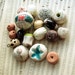 Its own uses for things -- a loose destash set of 18 ceramic art beads and charms