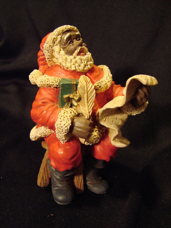 black santa claus figurine with good girls and by black santa claus figurine with good girls and by