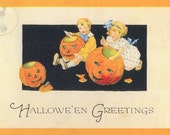 Vintage Halloween Decorating: This cute art print was sourced from an antique postcard showing children carving pumpkins
