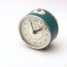 Vintage turquoise alarm clock made in Russia
