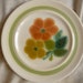 6.5" diameter vintage 70's Franciscan "Floral" Pattern hand decorated ceramic /bread/salad plate orange flowers, green ring and leaves