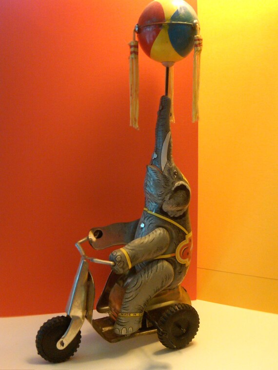 Vintage Metal WindUp Toy Elephant on a Bike with by LauraLeeNW