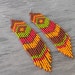 Long Native American Style Seed Bead Earrings in brown, olive, ruby and orange tones