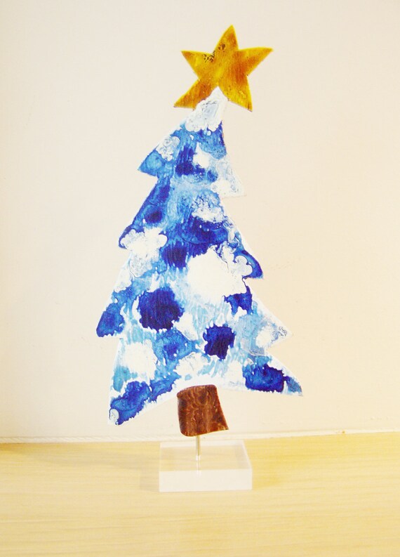 blue white christmas tree with yellow star on plexi glass blue white christmas tree with yellow star on plexi glass