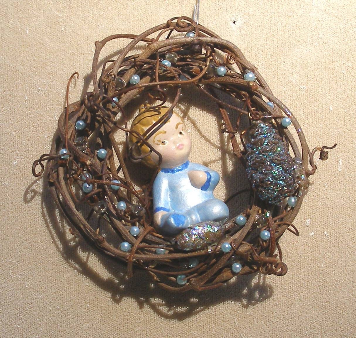 Baby boy in wreath tree ornament