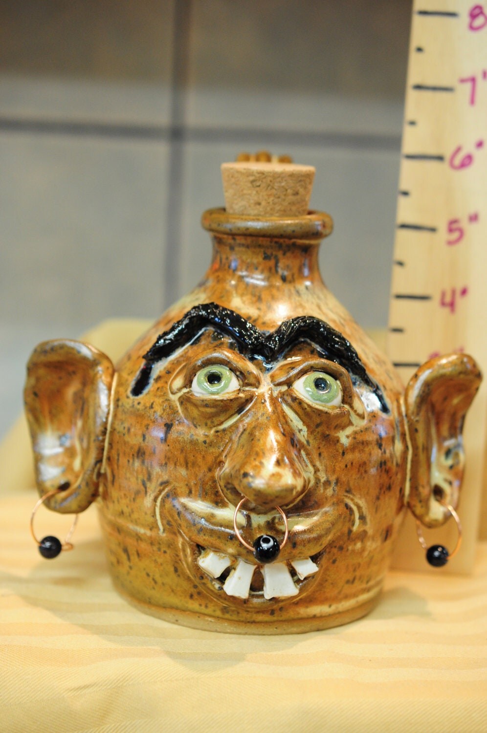 Stoneware Pottery Ugly Face Jug with Earrings and Nose Ring.