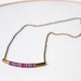 Brass Tube Necklace - dyed multicolor cotton thread wrapped
