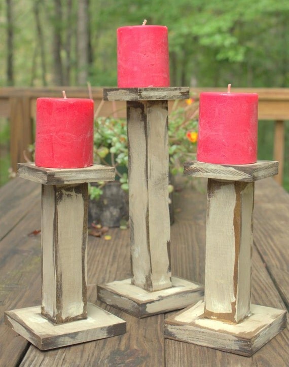 Items similar to Primitive Distressed wooden candle holders, set of