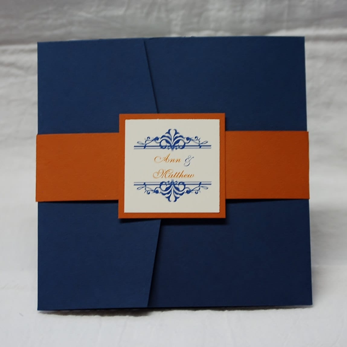 Navy and Orange Flourish square pocketfold wedding invitation