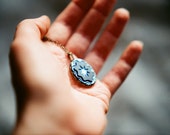 Vintage iridescent star glass cabochon necklace in black and blue