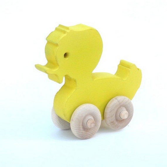 Items similar to yellow wooden duck toy on wheels push toy on Etsy