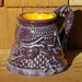Dragon turning into a mug or mug turning back into a Dragon