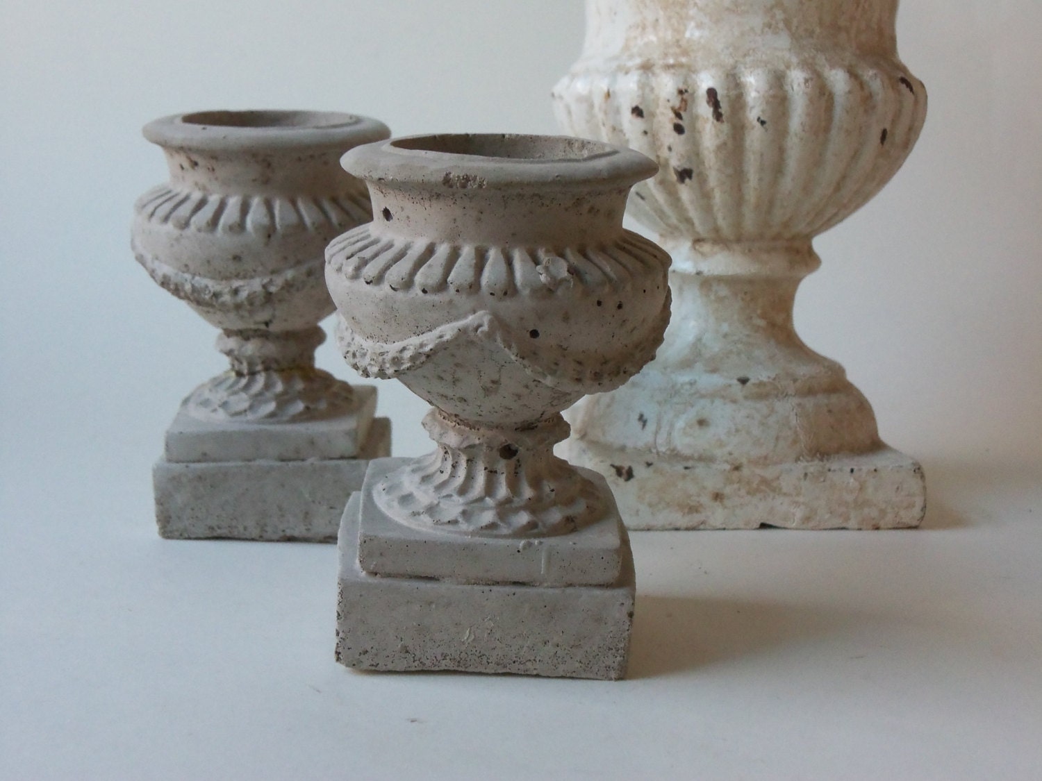 two cement urns