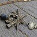 THE SCRYING ROOM . Aged patina double torches keyhole escutcheon, Lavastone, crystal and Vintage key necklace.