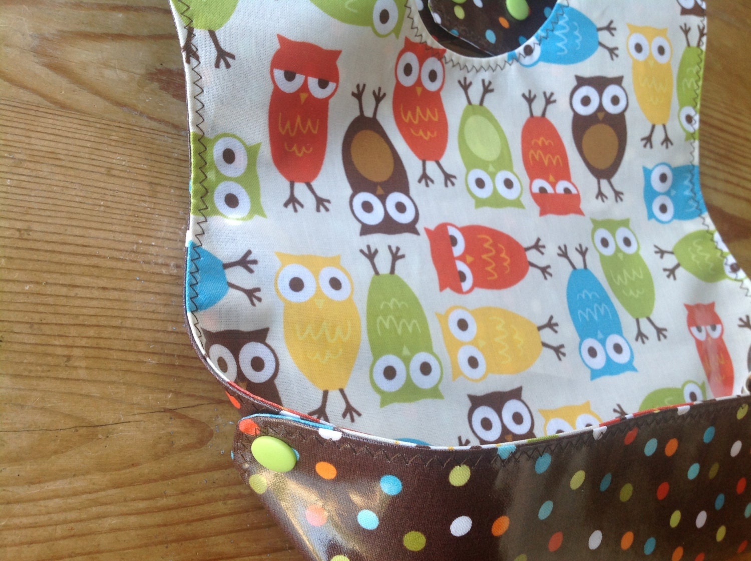 Bib for toddler Laminated Snappy Pocket Bib with Urban Zoologie Owls and slicker brown polka dots by Robert Kaufman