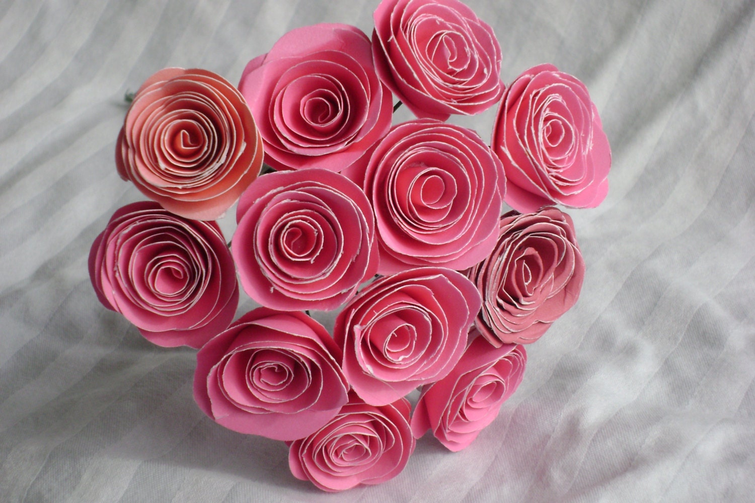 one dozen small pink spiral rolled paper roses bouquet made