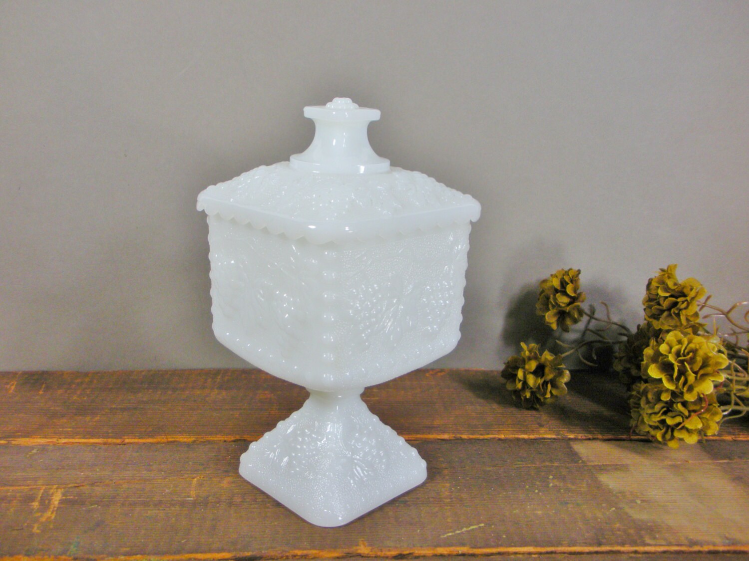 Milk glass candy dish with lid / grape vine design / container