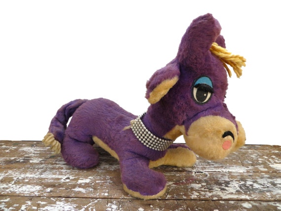 stuffed purple dog