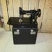 reserved for JIMBO0610 Singer Featherweight Sewing Machine. w case / keys and attachments.