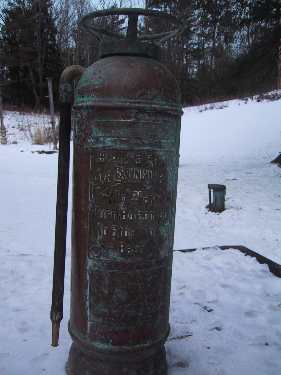 Antique Badger Fire Extinguisher with extensive patina