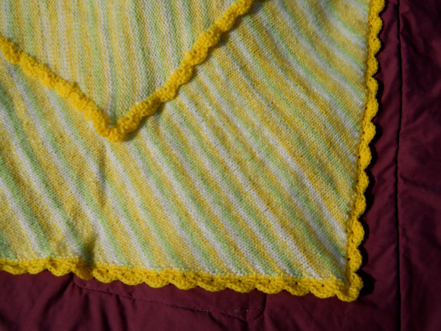 Variegated Knitted Baby Blanket with Yellow Shell Edging