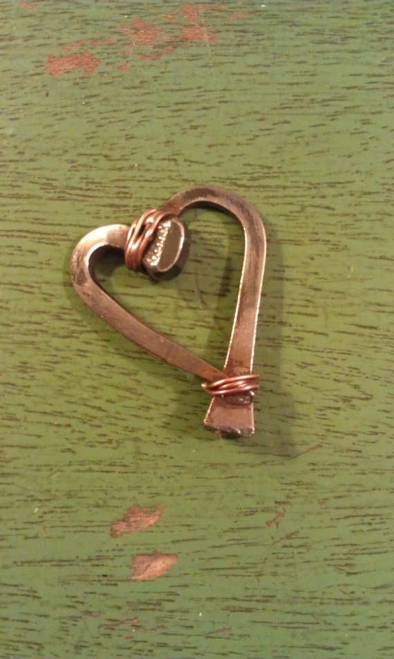 Items similar to Horseshoe Nail Heart Pendant on Etsy