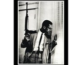 malcolm x with gun shirt