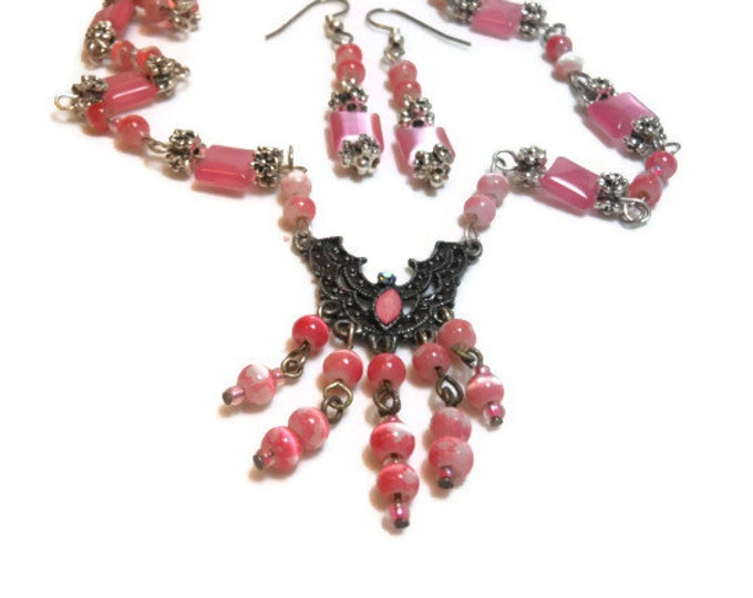 Pink fiber optic glass necklace and earrings made with upcycled beads and festoon beadwork earrings in silver plate