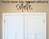 Items similar to You&#39;re Never Fully Dressed Without a Smile.. vinyl wall decal sticker art on Etsy
