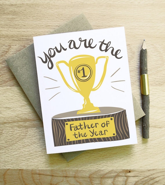 You Are the Father of the Year dads day card calligraphy handwriting gold brown wood congrats new baby award trophy clever funny handsome