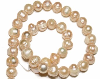 Jumbo creamy light peach baroque potato pearls. Approx. 12-14mm. Select a quantity