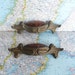 2 vintage ornate Art Nouveau distressed metal pull handles with tortoiseshell inserts includes hardware